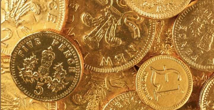 Pre-decimal British currency coins including farthings, shillings, and crowns
